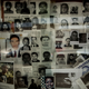 Images of missing people are tacked to a wall at the capital's Institute of Legal Medicine